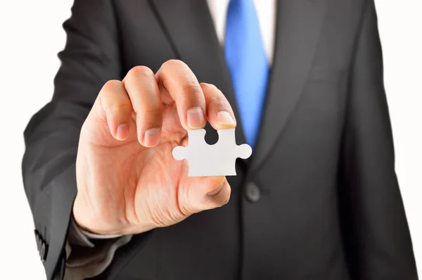 Business man showing jigsaw puzzle — Stock Photo, Image