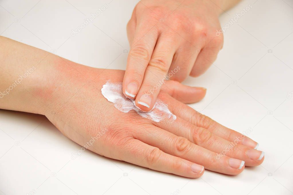 putting moisturizer on my hand