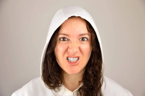 Snarling woman wearing hoodie — Stock Photo, Image