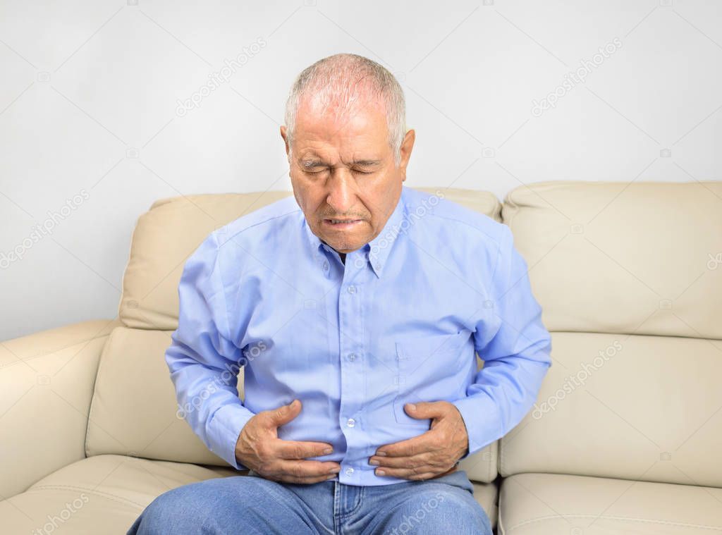 senior man with stomachache