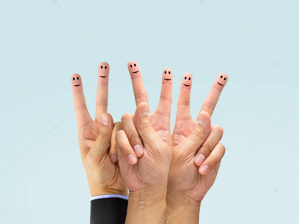 Close-up of fingers with smiley face isolated on white background .The screen content is designed by me and not is copyrighted by others and created with wacom tablet and PS
