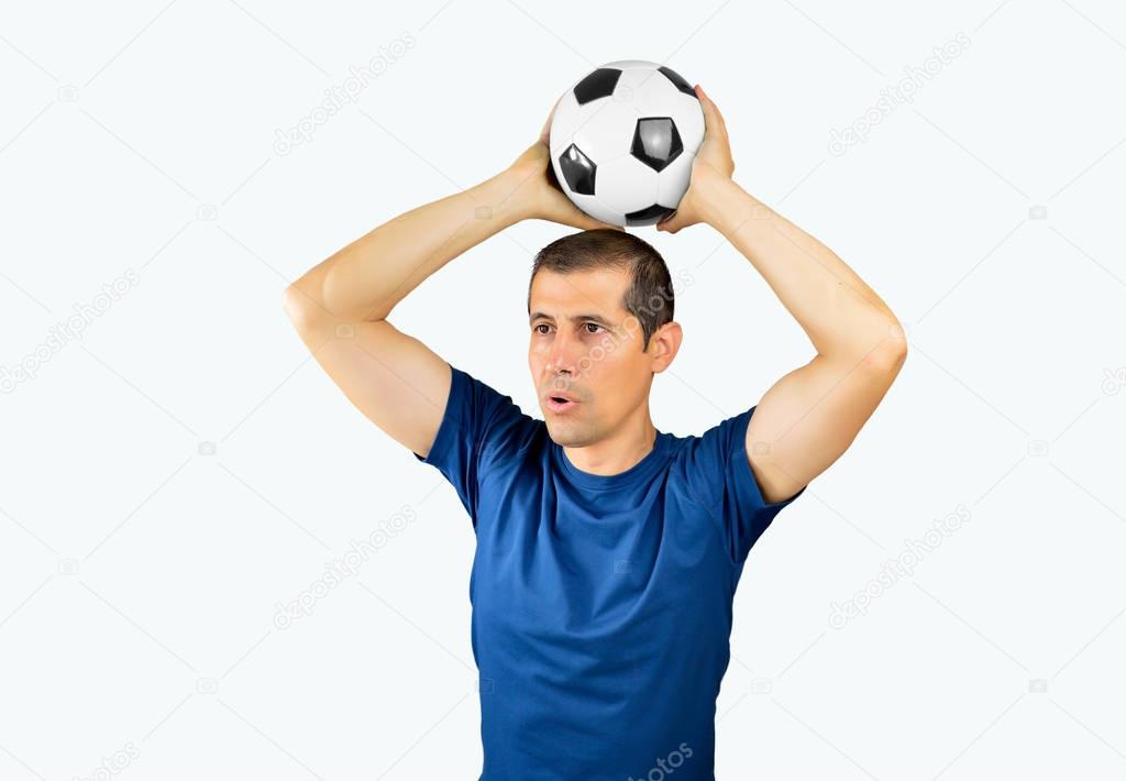 Cropped shot of a young soccer player taking the ball high against a white background