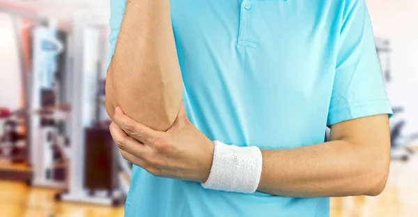 Sport man with elbow injury — Stock Photo, Image