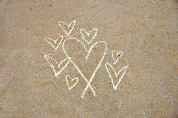 white chalk hearts on the wall