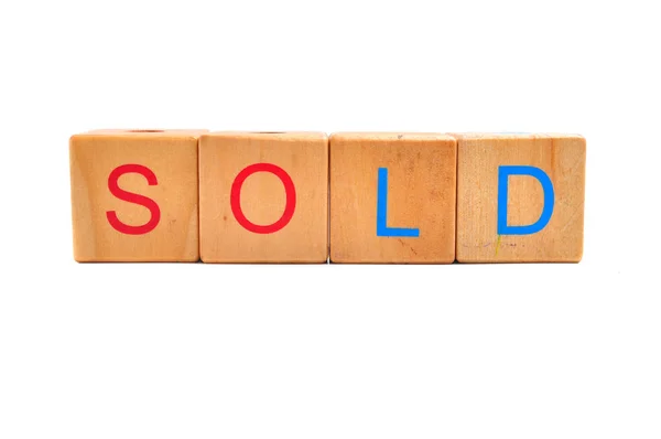 Sold Text on wooden block — Stock Photo, Image