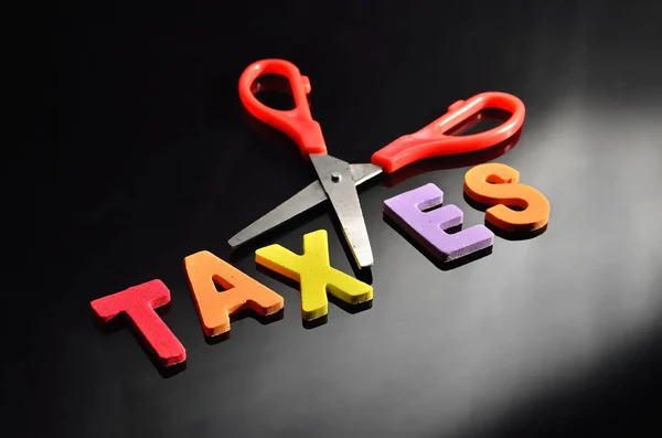 scissors and the alphabet TAXES