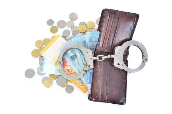 Cash money and handcuffs. the concept of crime and corruption — Stock Photo, Image