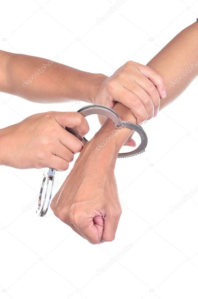 Man hands with handcuffs got arrested isolated on white background