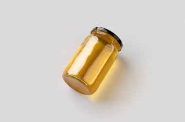 Gri arkaplanda bal kavanozu modeli.