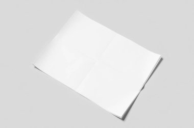 Gri arka planda boş bir gazete maketi..