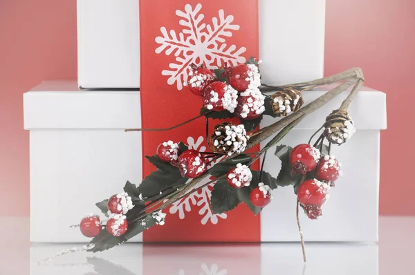 Stack of festive red and white theme Christmas gift boxes — Stock Photo, Image