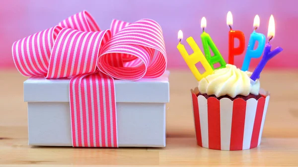 Happy Birthday cupcake with colorful candles — Stock Photo, Image