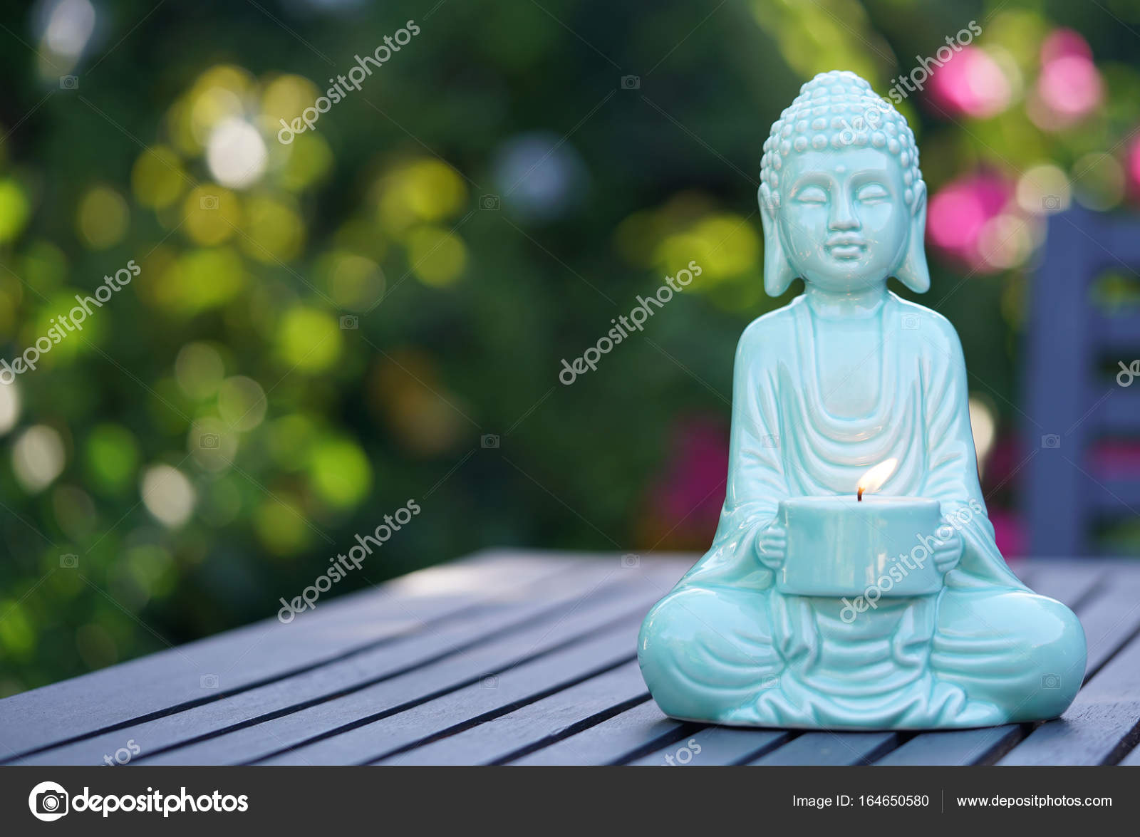 Aqua blue Buddha statue Stock Photo by ©amarosy 164650580
