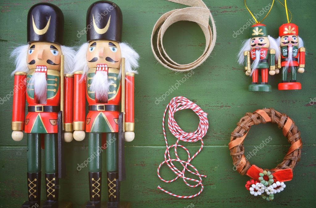 Happy Holidays Christmas background flat lay with ornaments on a green rustic wood background.