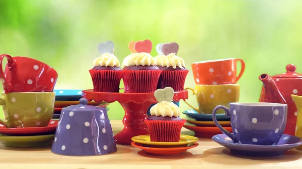 Colorful Mad Hatter style tea party with cupcakes — Stock Photo, Image