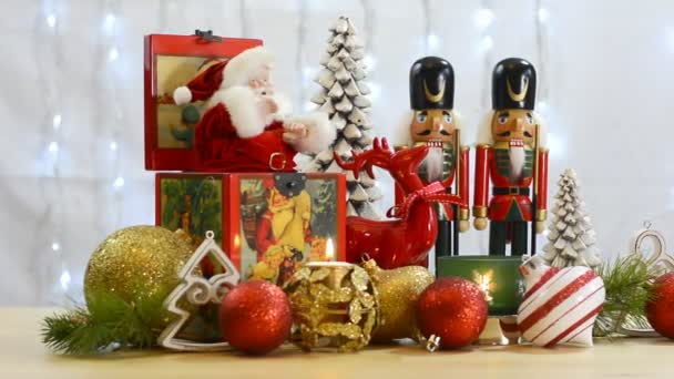 Festive Christmas ornaments with vintage Santa music box. — Stock Video