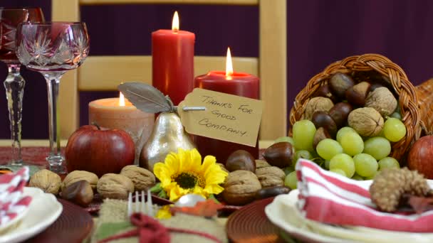 Thanksgiving table with place settings and cornucopia centerpiece — Stock Video