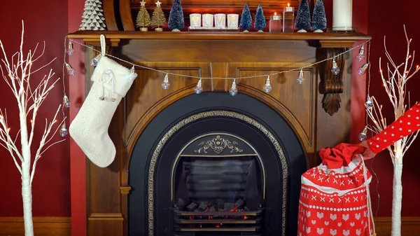 Cosy Christmas holiday decorated mantelpiece and fire place