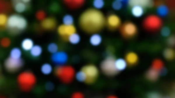 Bokeh defocused lights of a festive Christmas Tree — Stock Photo, Image