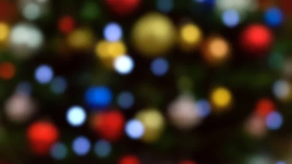 Bokeh defokussierte Lichter eines festlichen Weihnachtsbaums — Stockfoto