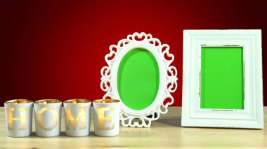 Antika fotoğraf çerçevesi yeşil ekran ve yanan ev mum.