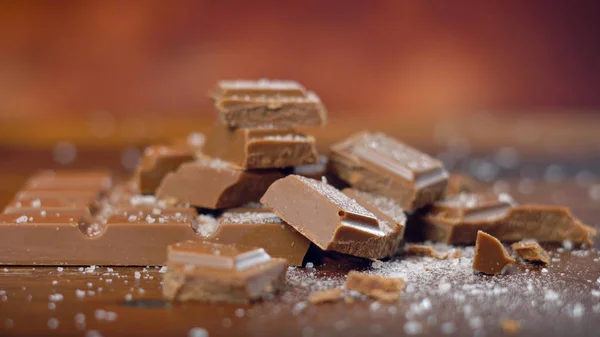 Sweet and salty chocolate snacks, salted caramel bar, macro close up — Stock Photo, Image