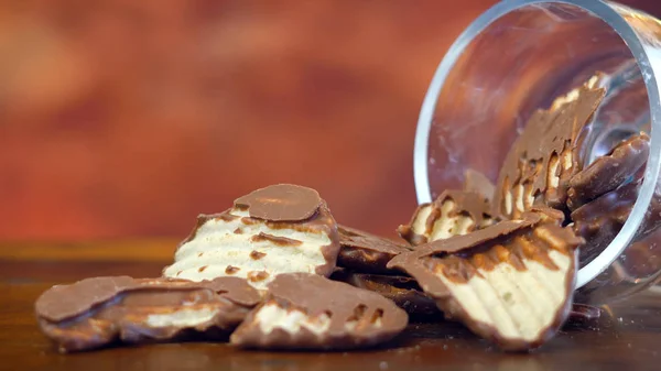 Chocolate covered salt and vinegar potato chips, macro close up — Stock Photo, Image