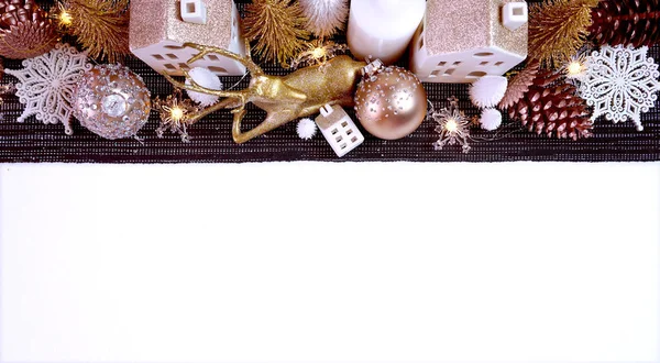Christmas table centerpiece with rose gold, white and gold ornaments.