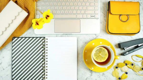 Modern desk flat lay overhead with touchcreen laptop and yellow accessories. — Stock Photo, Image