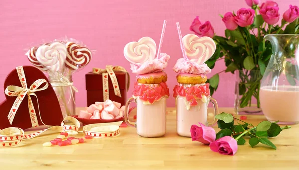 Valentines Day freak shakes with heart shaped lollipops and donuts. — Stock Photo, Image