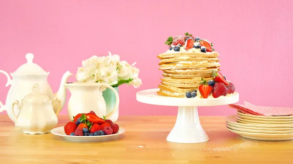 Pancake Tuesday stack of pancakes cake with whipped cream and fresh berries. — Stock Photo, Image
