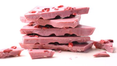 Ruby chocolate close up on white background.