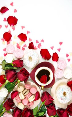 Red roses morning tea creative flat lay layout with coffee in heart shaped cup