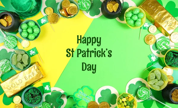 St Patricks Day flat lay with chocolate coins, leprechaun hat and shamrocks. — Stock Photo, Image