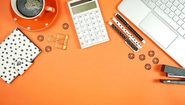 Desktop workspace with hi-tech laptop and modern colorful accessories.