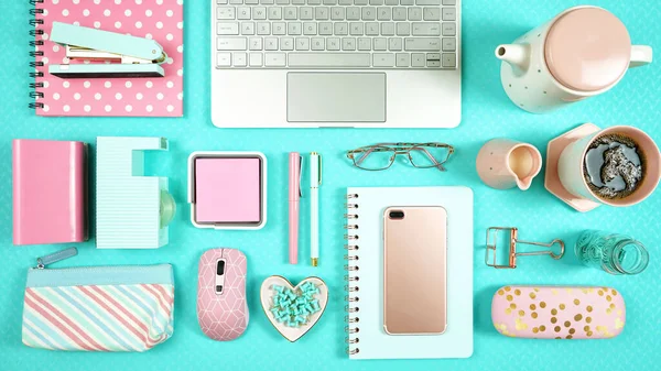 Desktop workspace with hi-tech laptop and modern colorful accessories.