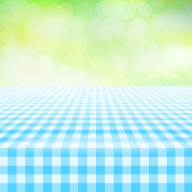 Boş piknik Pötikareli masa örtüsü, yeşil arka plan
