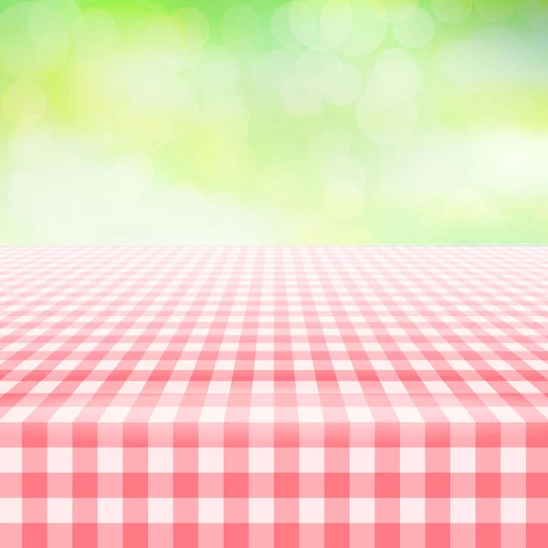 Tovaglia vuota picnic gingham, sfondo verde — Vettoriale Stock