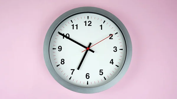 Close up wall clock face beginning of time 06.50 am or pm. on white background, Time concept