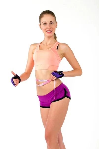 Zdravá Kavkazský žena s páskou opatření na bílém pozadí. fitness gym koncept — Stock fotografie