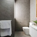 stock-photo-charcoal-grey-bathroom-with-marble