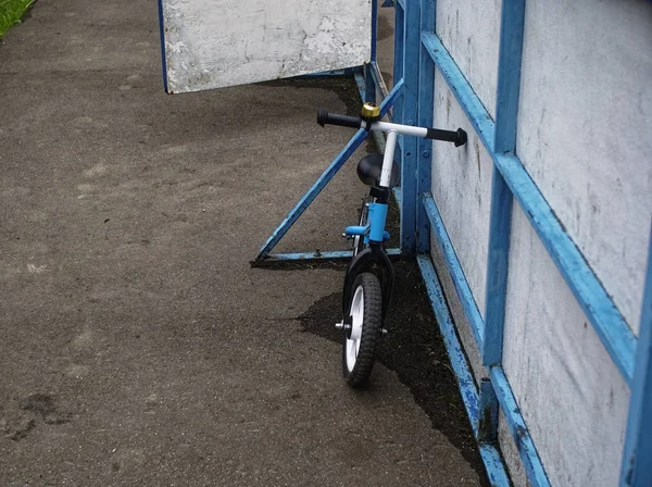 a balance bike is on the small stadium in the summer, Mosco