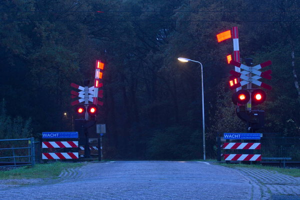 Hoogeveen, the Netherlands - November 4, 2019: railway crossing in Fluitenberg municipality of Hoogeveen, the Netherlands
