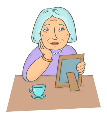 Fotoğraf çerçevesi tutan yaşlı kadın