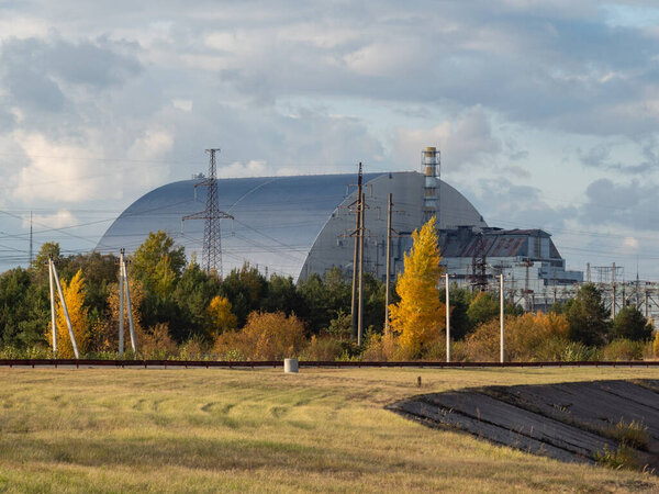 Reactor 4 at the Chernobyl nuclear power plant with a new sarcophagus. Global atomic disaster. Chernobyl Exclusion Zone. Ukraine