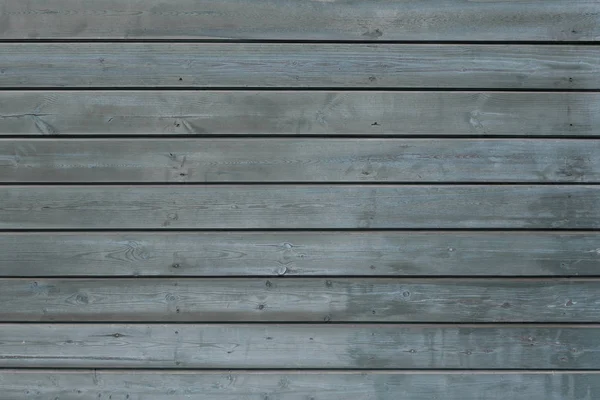 Textura azul fundo de madeira. Fundo de várias placas horizontais naturais de cor azul. A velha parede pintada . — Fotografia de Stock
