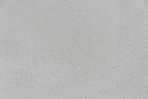 White concrete wall with a flat surface and small pores. Gray surface for design background texture. — Stok fotoğraf