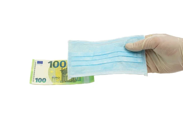 Ręka Rękawiczkach Ochronnych Trzyma Niebieską Maskę Medyczną 100 Euro Koncepcja — Zdjęcie stockowe