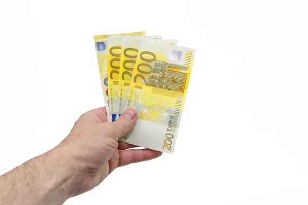 200 200ユーロのファン ヨーロッパの男性の手はヨーロッパのお金のファンを保持しています 隔離された白い背景 — ストック写真