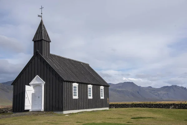 The Buir black church is one of 3 black churches in Iceland. They are black because the exterior wood is painted with pitch, just like the hull of a boat. This is to protect it from the harsh Icelandic elements.